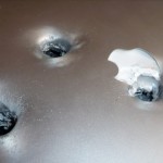 apple_mackbook_bullet_hole apple_mackbook_bullet_hole