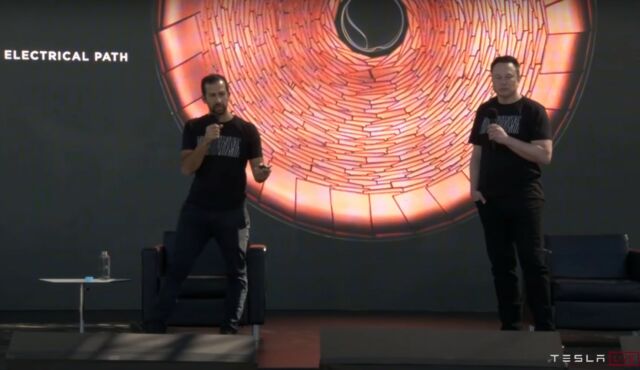 Elon Musk and Drew Baglino present in front of a slide showing Tesla's new 'tabless' cell design.